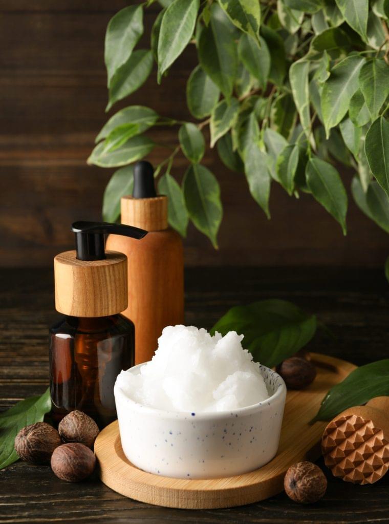 Concept of skin care cosmetics on wooden table, Shea butter Concept of skin care cosmetics on wooden table, Shea butter